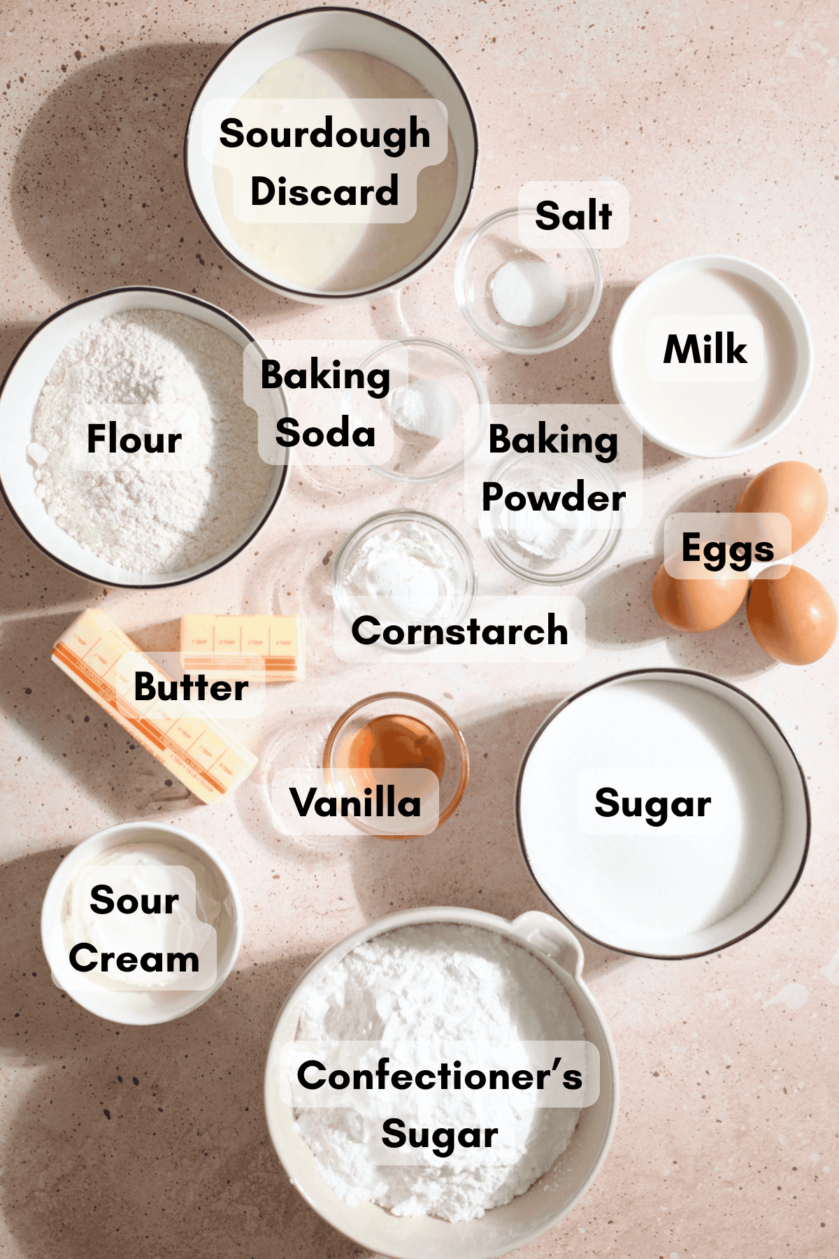 Ingredients for Sourdough Vanilla Sheet Cake in small bowls.