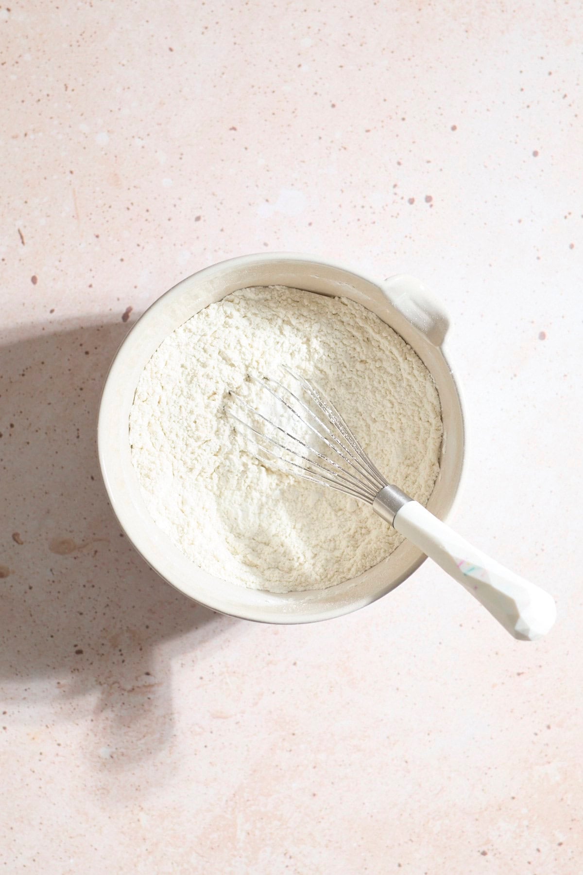 Dry ingredients mixed in a large mixing bowl.