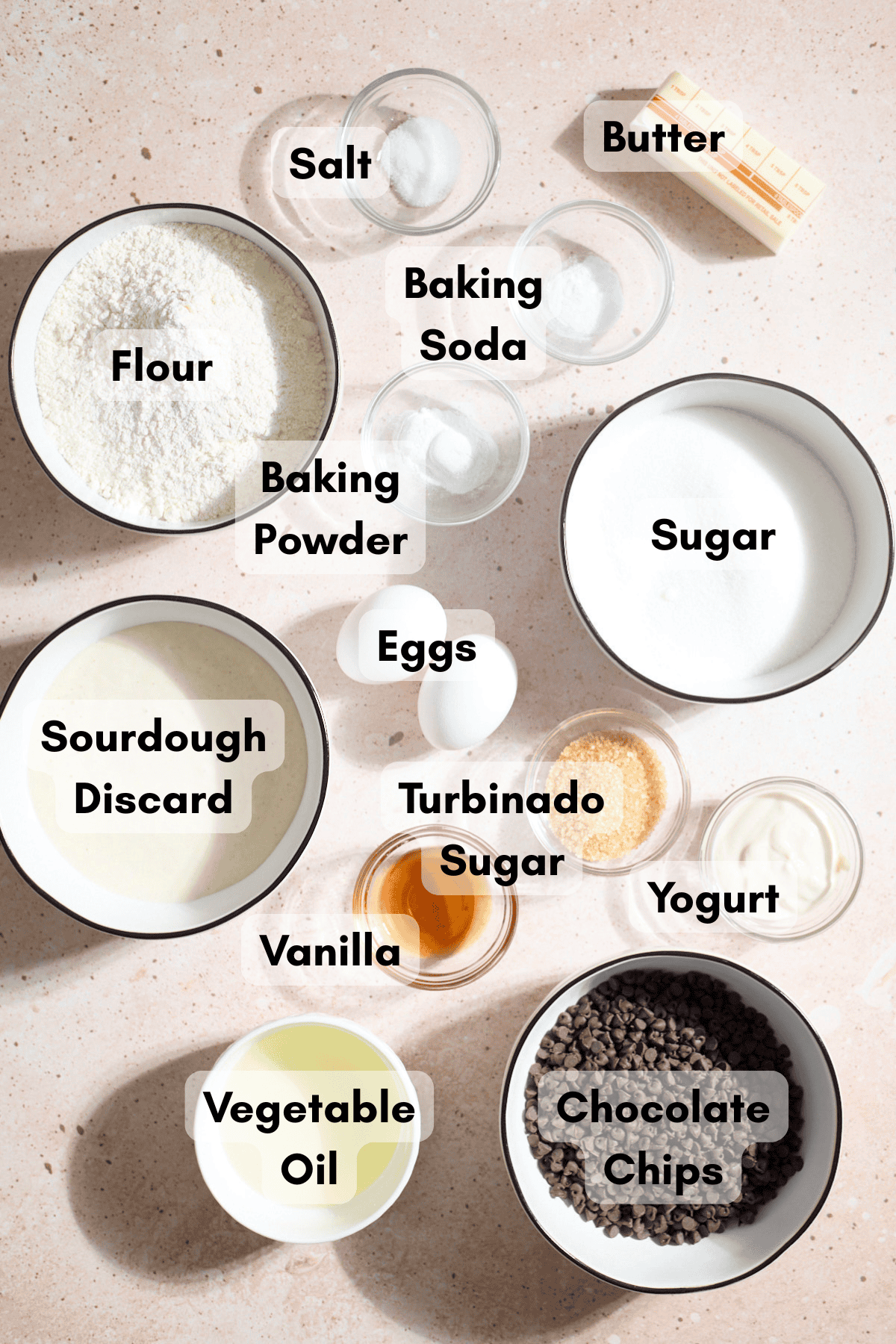 Ingredients for Sourdough Discard Chocolate Chip Muffins in small bowls.