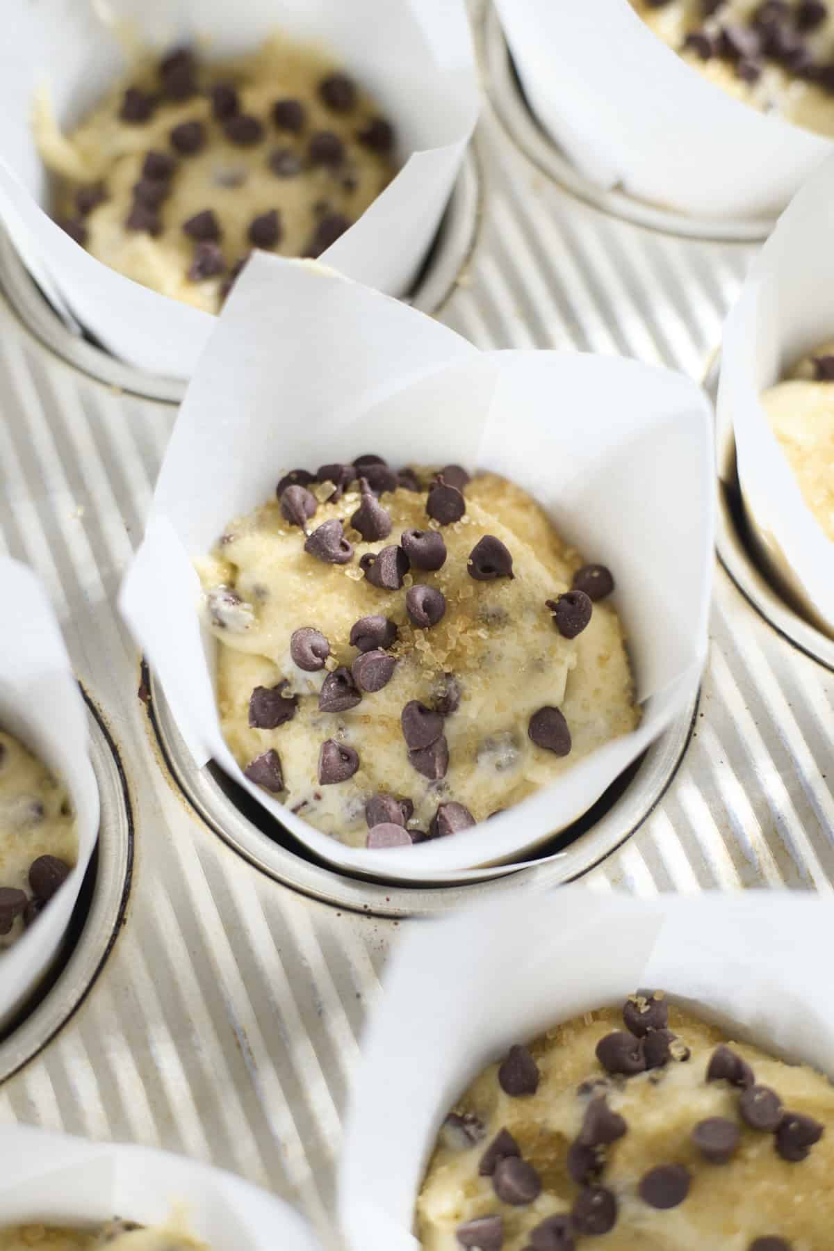 Batter topped with chocolate chips and turbinado sugar.