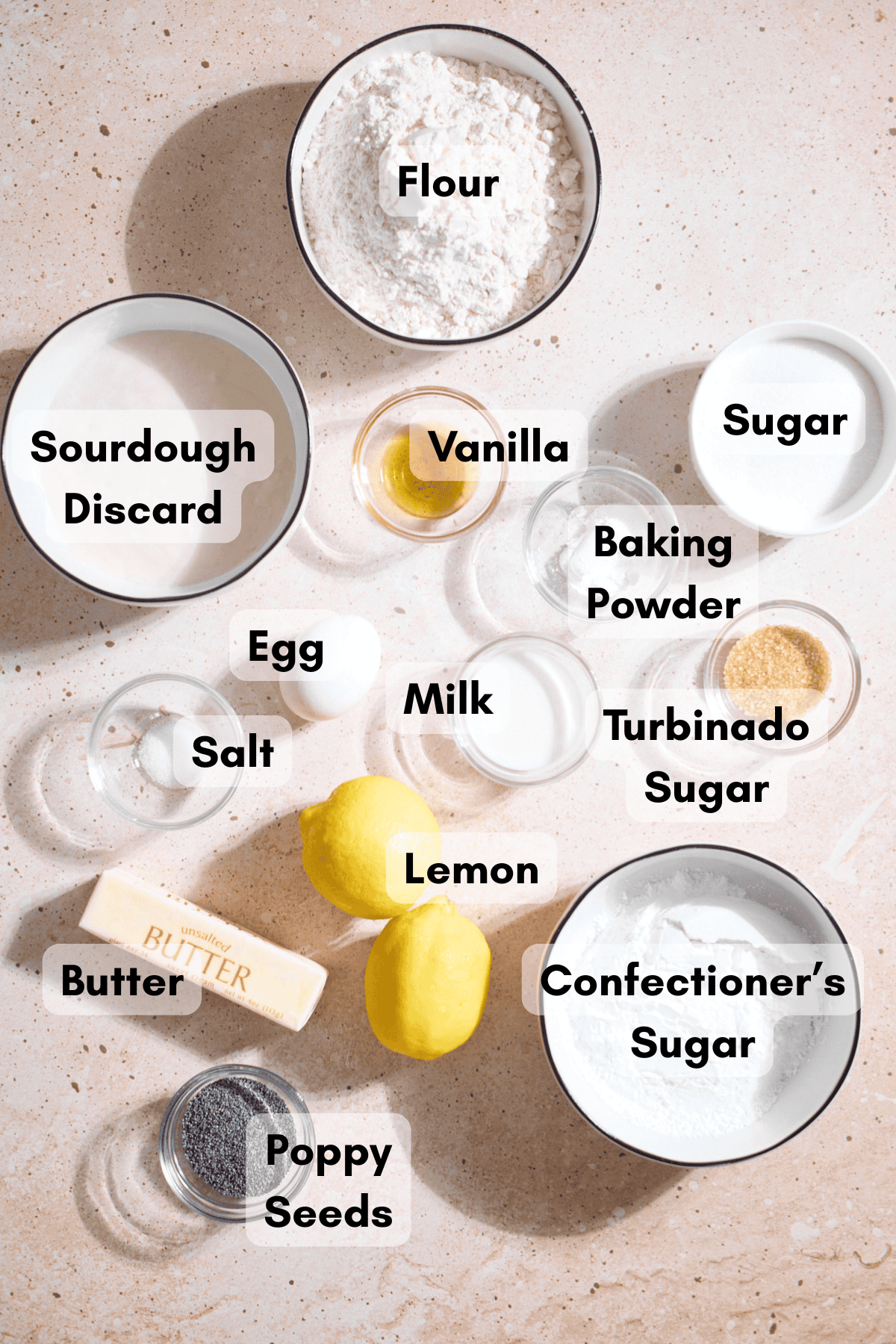 Ingredients for Sourdough Lemon Poppy Seed Scones in small bowls.