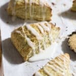 Sourdough Discard Lemon Poppy Seed Scones on white parchment paper.