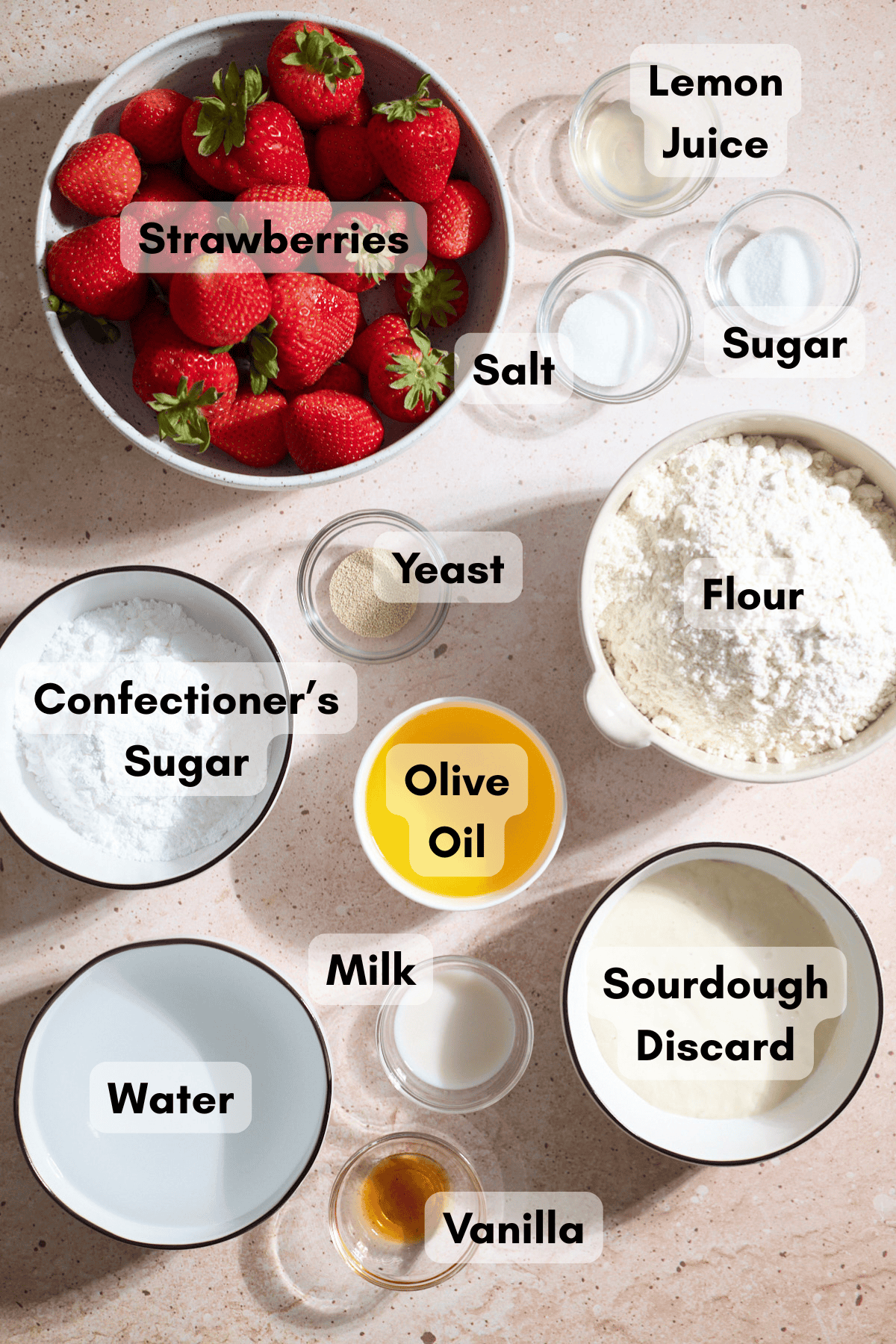 Ingredients for Sourdough Strawberry Donut Focaccia in small bowls.