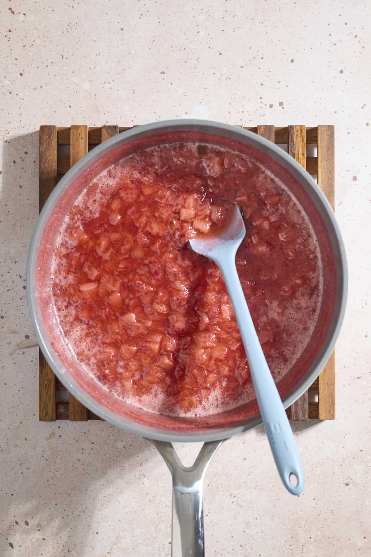Strawberry jam mixture in a skillet.