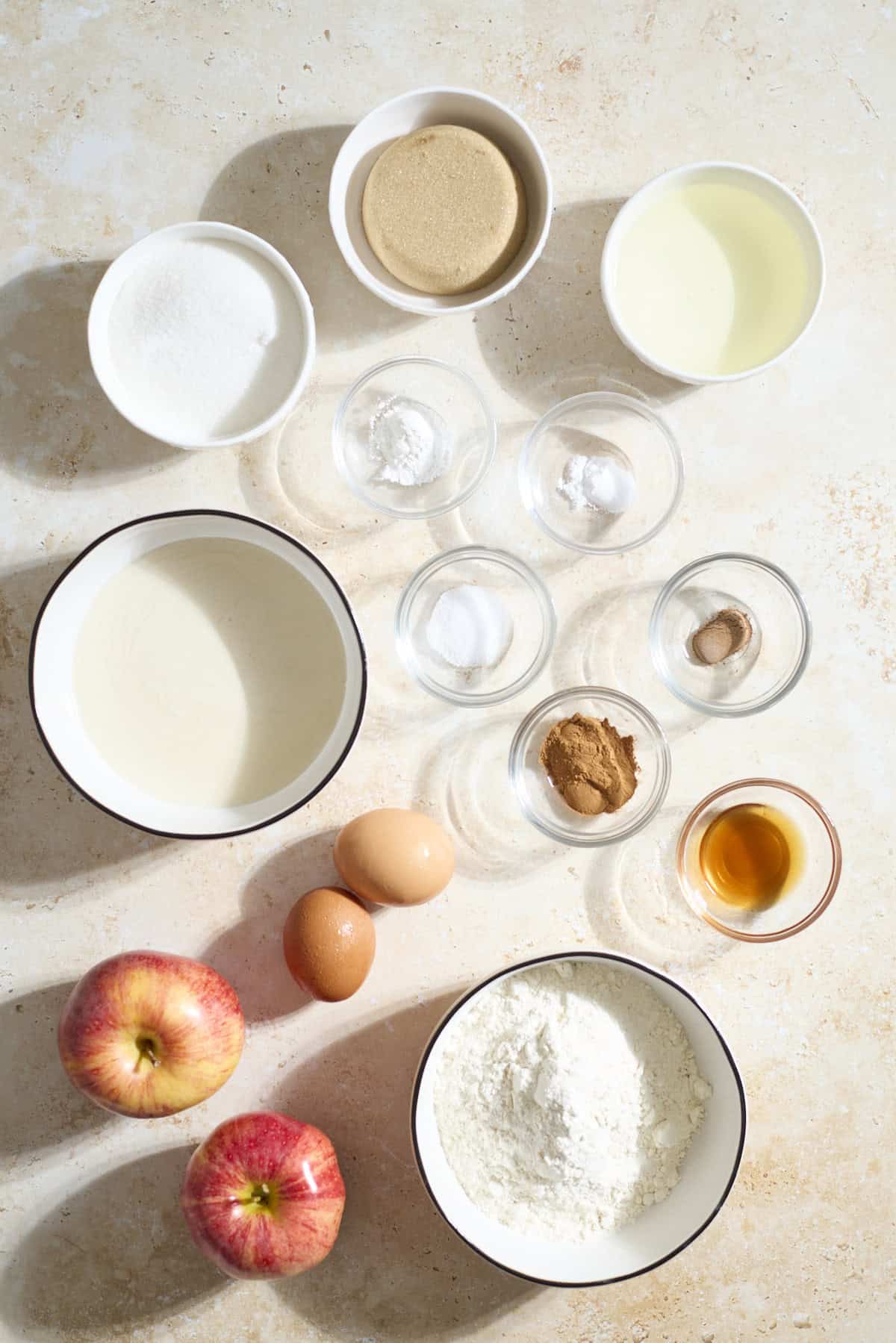 Ingrdients for Sourdough Discard Apple Cake in small bowls.
