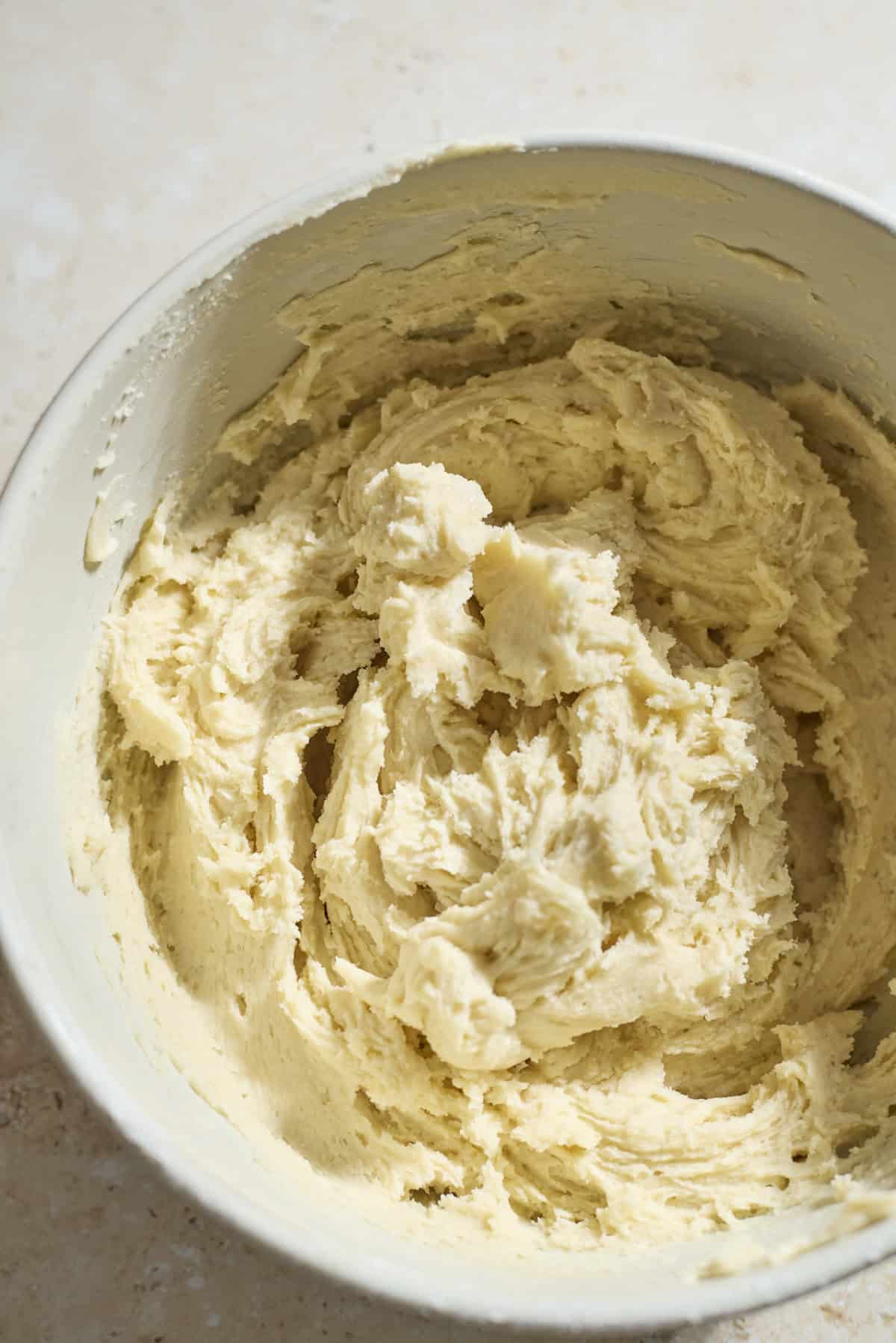 Cookie dough in a large mixing bowl.