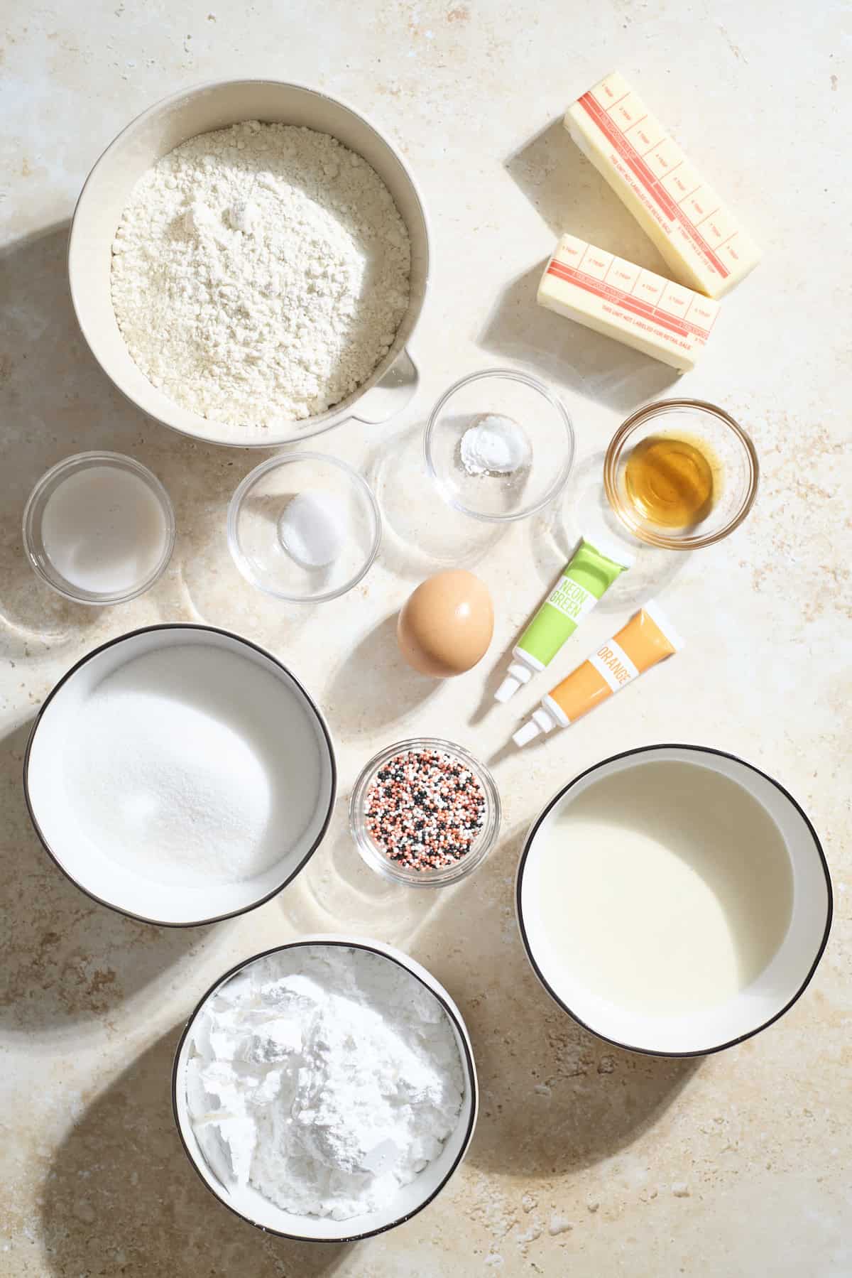 Ingredients for Sourdough Discard Halloween Sugar Cookies in small bowls.